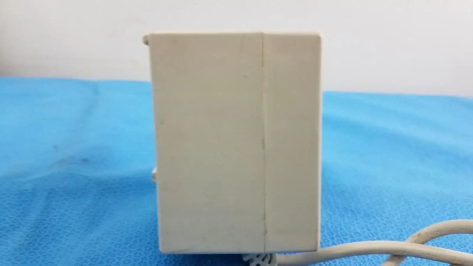 Beige rectangular raydow rd-b-24 multi-function control box with seam and cable for reuse medical equipment actuators