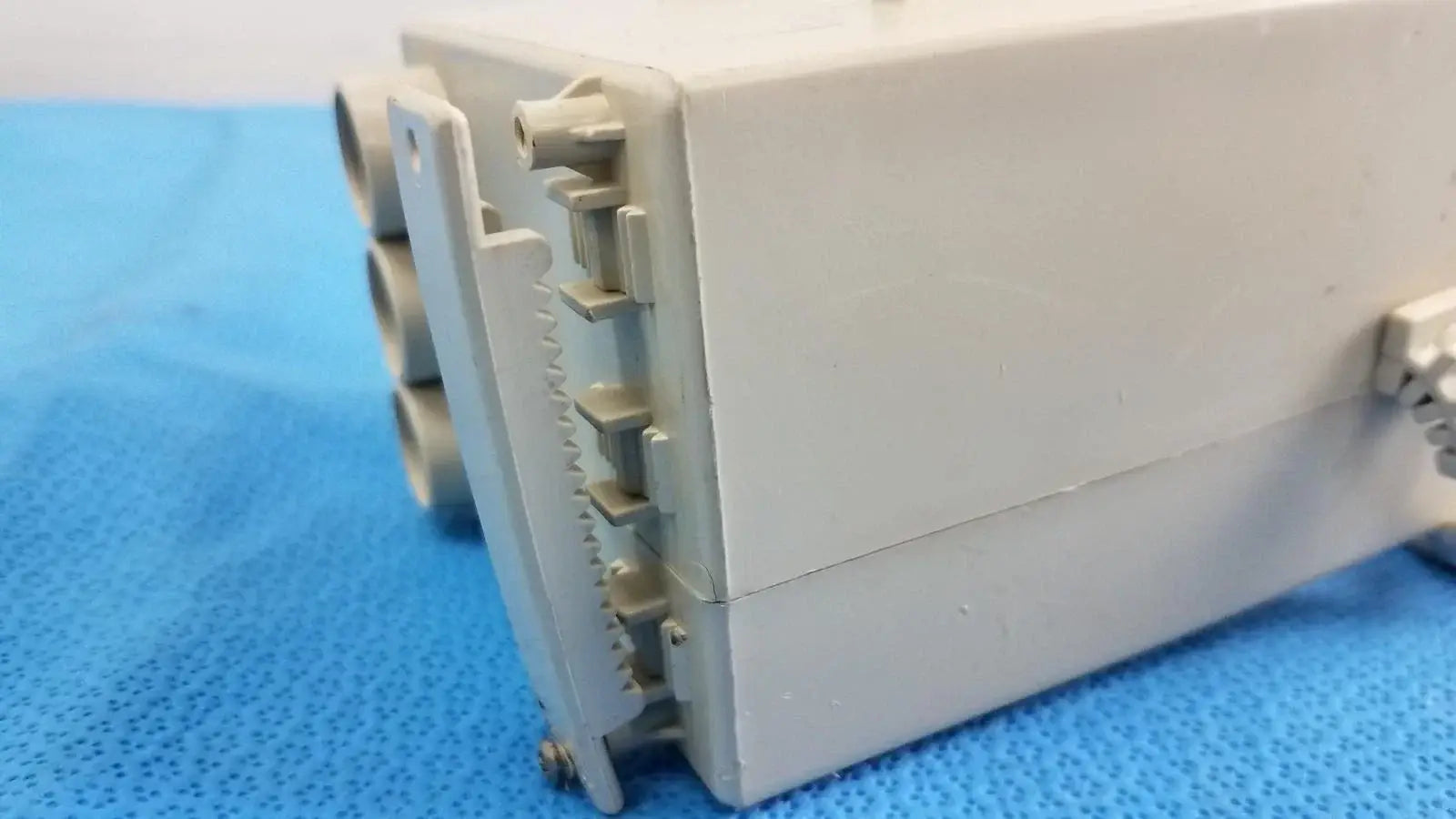 Beige plastic raydow rd-b-24 multi-function control box with circular ports and gear latch for reuse medical equipment