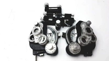 Black and silver Reichert 11625 minus cylinder phoropter refracting instrument with adjustable lenses and some damage