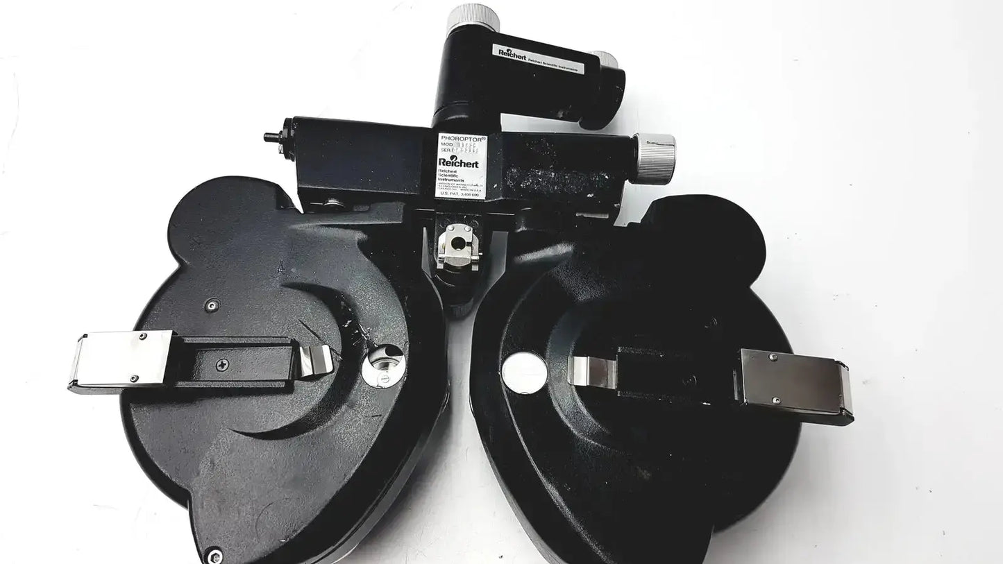 Black plastic and metal Reichert 11625 minus cylinder phoropter refracting instrument with central control and eye chart holders with some damage