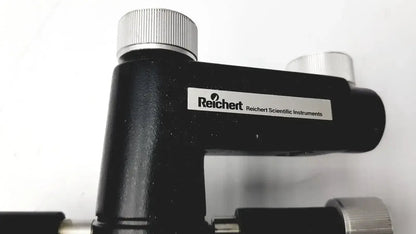 Black Reichert 11625 minus cylinder phoropter refracting instrument with silver knurled knobs showing some damage