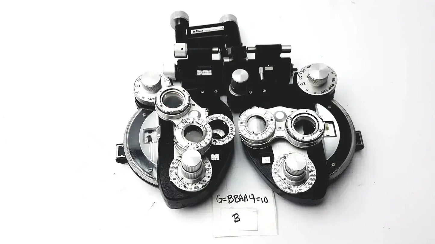 Black and silver Reichert 11625 minus cylinder phoropter refracting instrument with multiple dials and some damage