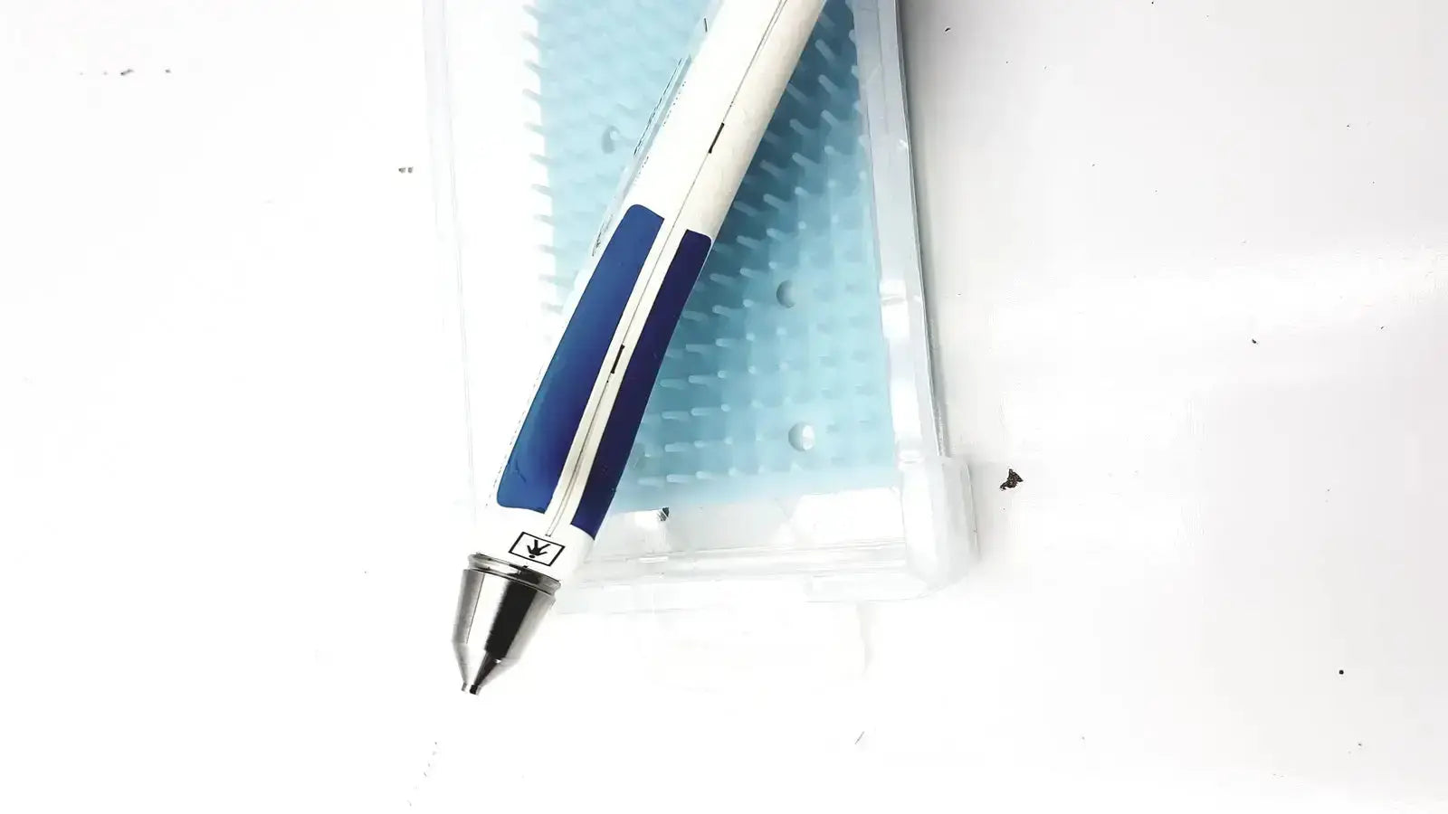 Blue and white ballpoint pen with metallic tip featured in reichert avia tono-pen tonometer product design