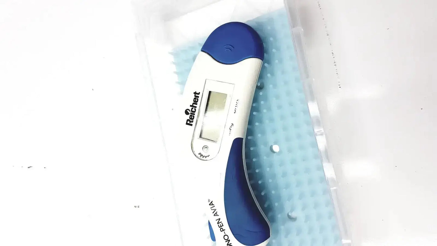 Blue and white digital thermometer with sleek ergonomic design for accurate readings in Reichert Avia Tono-Pen tonometer