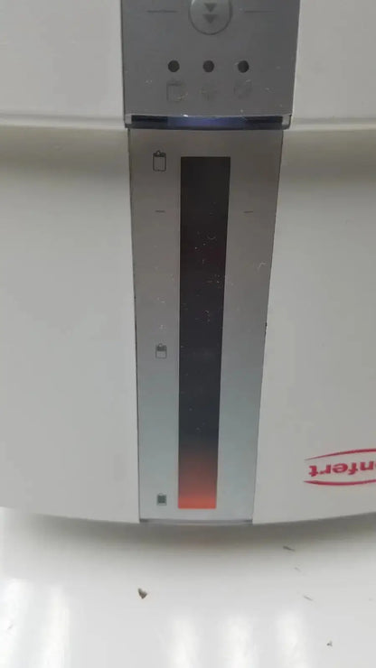 Silver metallic vertical slot on white renfert duomix ii automatic dental impression mixing machine with red branding