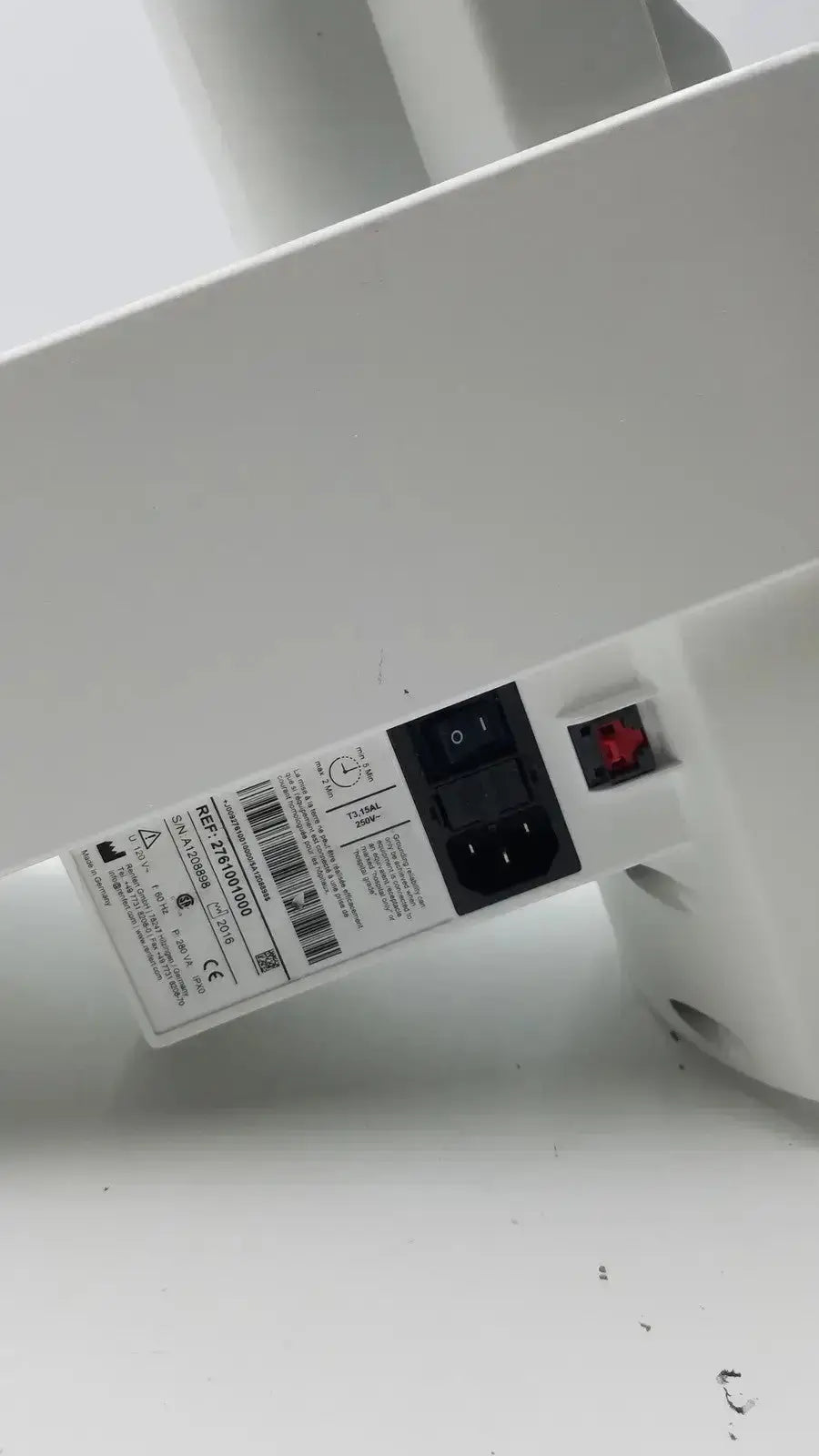 White plastic electric heater with black power plug and red reset button for renfert duomix automatic dental impression mixing