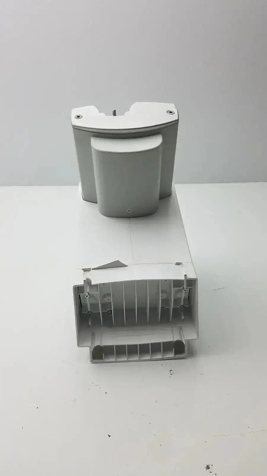 Gray plastic printer cartridge with vertical slits for renfert duomix ii automatic dental impression mixing device