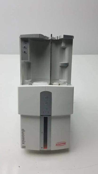 White plastic laboratory mixer with gray top and vertical panel labeled duomix ii for automatic dental impression mixing