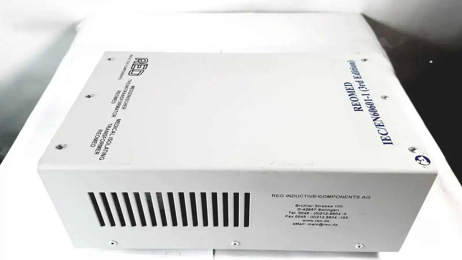 White rectangular reo reomed 600 3rd edition medical isolating transformer with black ventilation slits and printed text
