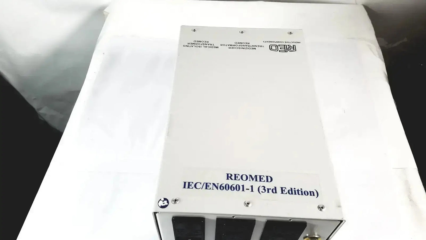 White rectangular reo reomed 600 medical isolating transformer 3rd edition with black ventilation slots and silver screws