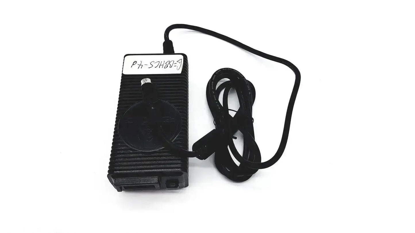 Black plastic respironics power charger with ribbed texture and coiled cable for efficient power supply