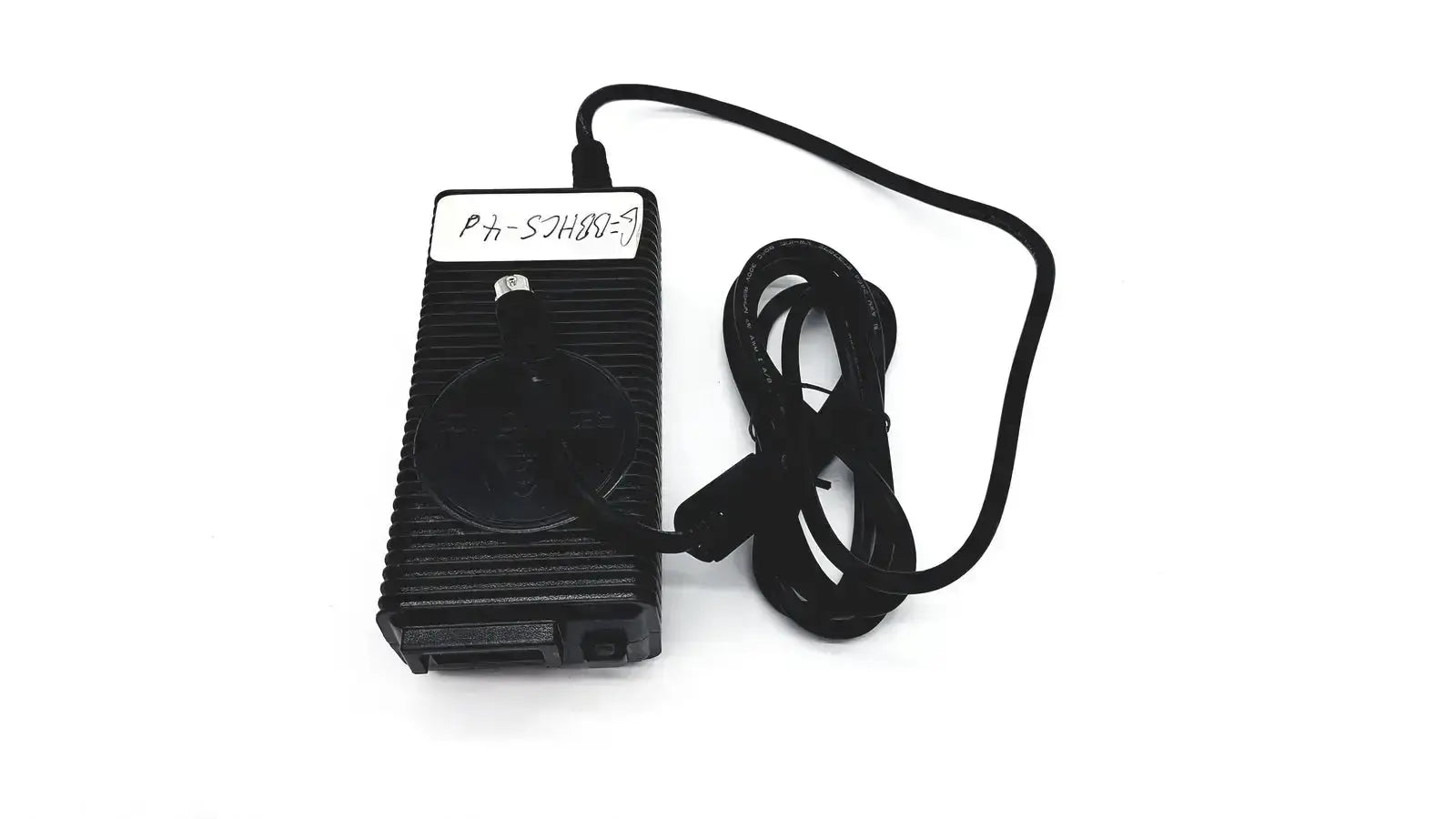 Black plastic respironics power charger with ribbed texture and coiled cable for efficient power supply