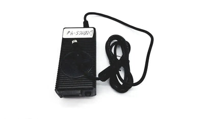 Black plastic respironics power charger with ribbed texture and coiled cable for efficient power supply