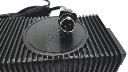 Black plastic respironics power charger with circular connector and ribbed heat sink design for reliable power charger use
