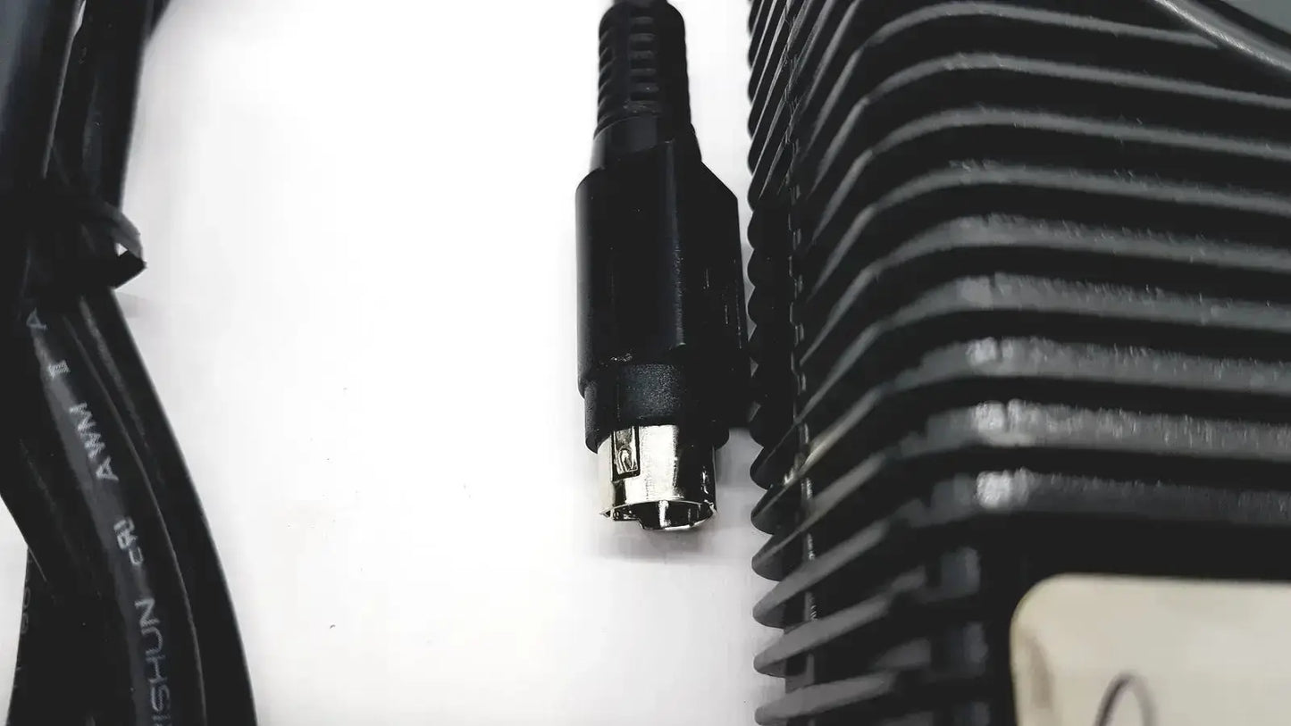 Black ps/2 connector with metallic pins and ribbed plastic housing for respironics power charger with cable