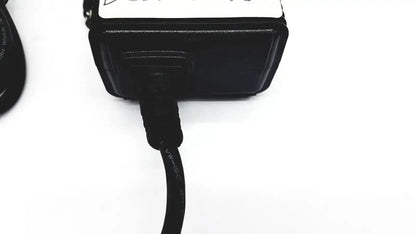Black plastic respironics power charger with coiled usb cable for efficient device charging and power supply