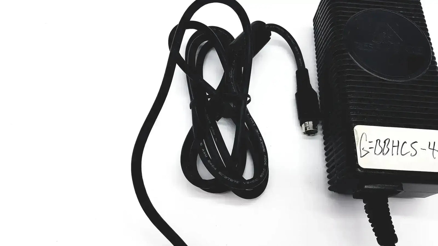Black plastic respironics power charger with ribbed texture and coiled cable for reliable power connection