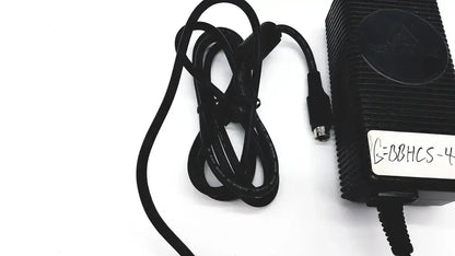 Black plastic respironics power charger with ribbed texture and coiled cable for reliable power connection