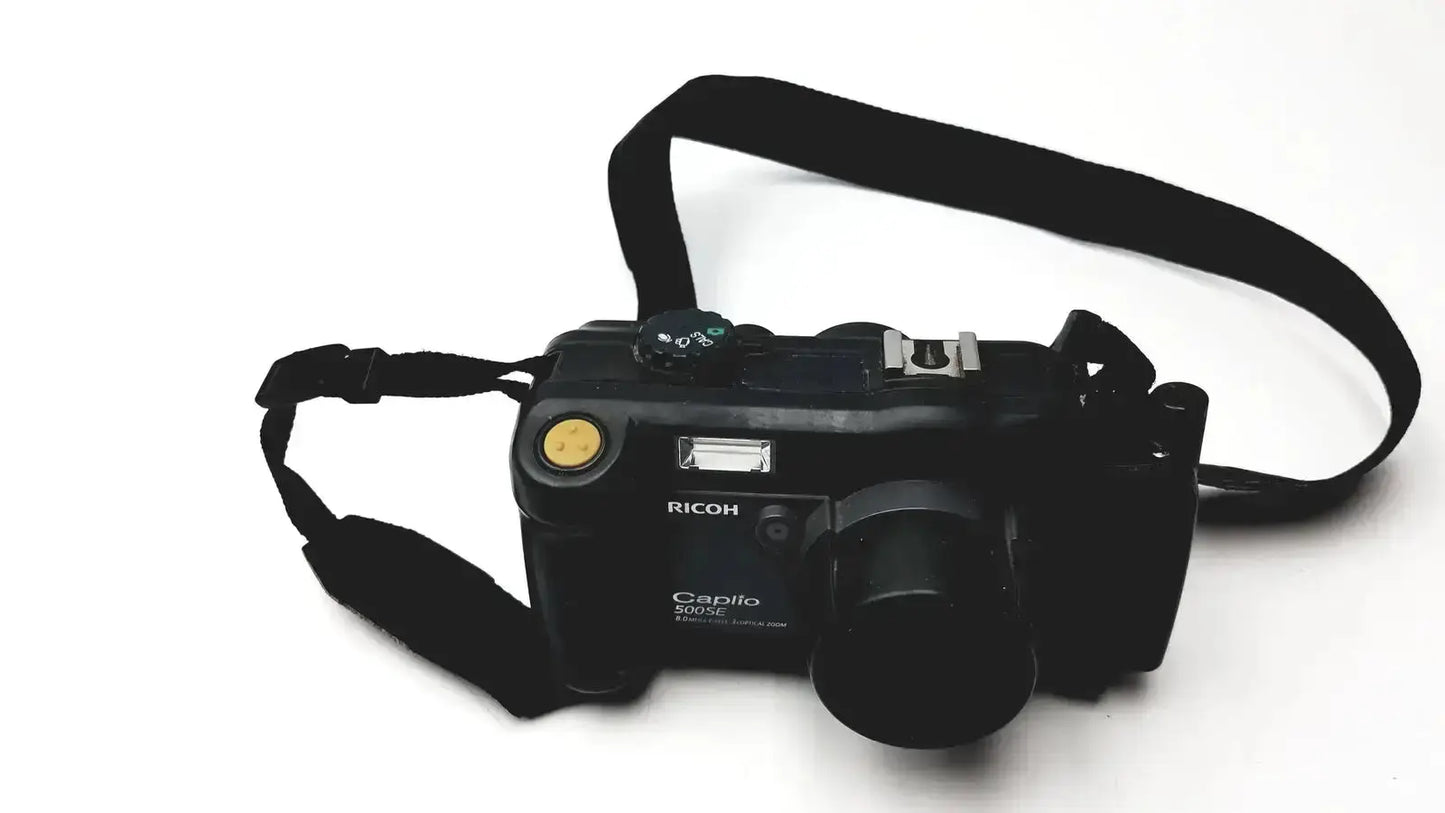 Black Ricoh Caplio 302SE digital camera with 8.0 megapixels 3x optical zoom digital camera and black strap