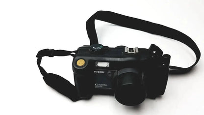 Black Ricoh Caplio 302SE digital camera with 8.0 megapixels 3x optical zoom digital camera and black strap