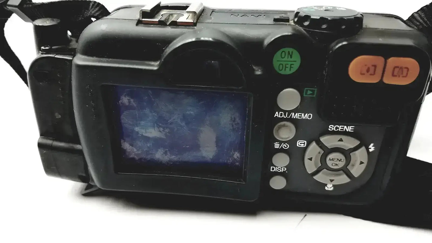 Black ricoh caplio 500se digital camera with small screen and orange buttons featuring 8 megapixels 3x optical zoom