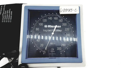 Blue-framed riester big ben square sphygmomanometer blood pressure monitor with black dial and white markings for adults