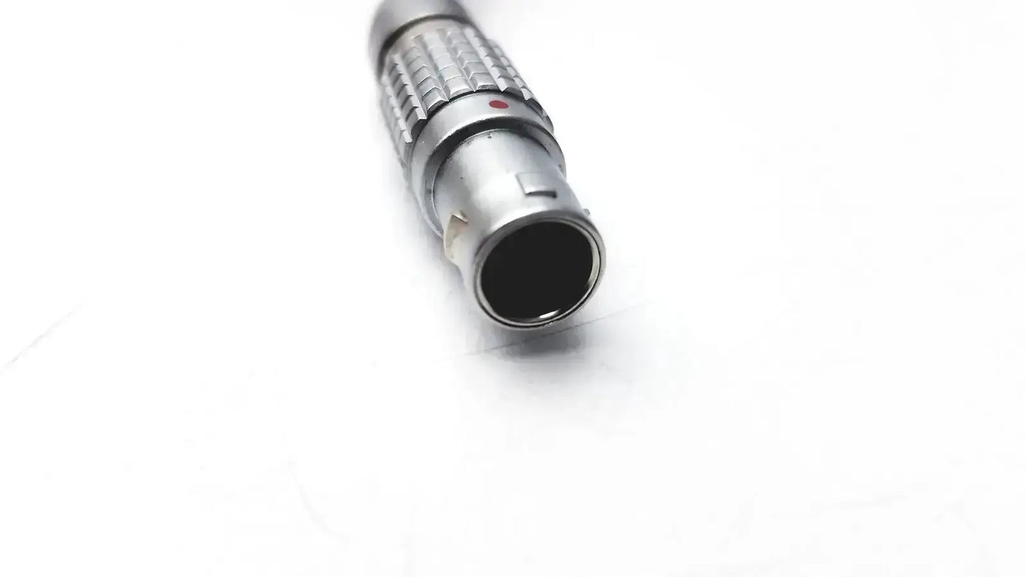 Silver metallic rigel medical adapter nellcor oximax with textured ribbed grip and small red dot near the top