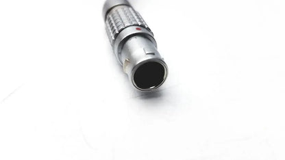 Silver metallic rigel medical adapter nellcor oximax with textured ribbed grip and small red dot near the top