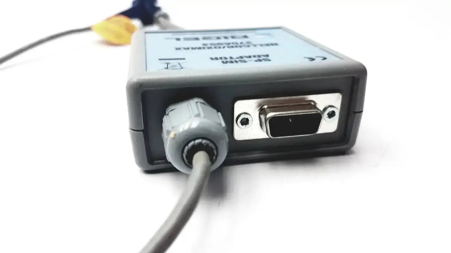Gray plastic rigel medical sp-sim adapter nellcor oximax with silver vga port and gray cable connector visible from the back side