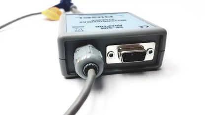Gray plastic rigel medical sp-sim adapter nellcor oximax with silver vga port and gray cable connector visible from the back side