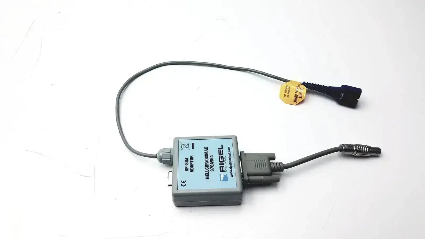 Gray rectangular rigel medical adapter nellcor oximax with two cables featuring blue and metallic threaded connectors