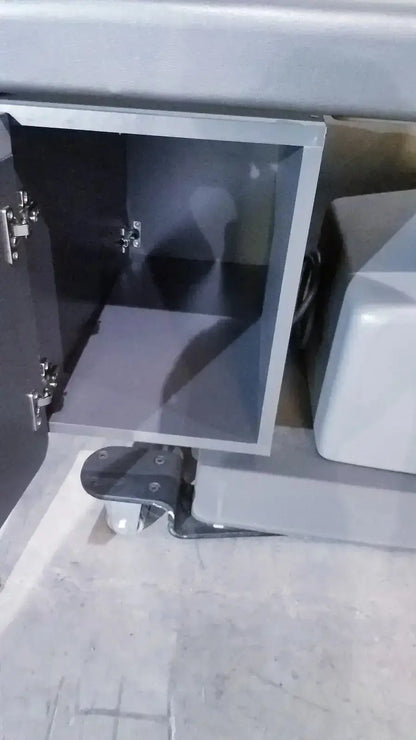 Gray metal cabinet with glass door and hinges shown with ritter 106 exam table featuring up and down foot paddle hospital surplus