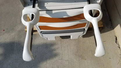 White plastic handrails with glossy finish and ergonomic curves on ritter by midmark exam table model 204-011 for pre owned medical equipment sale
