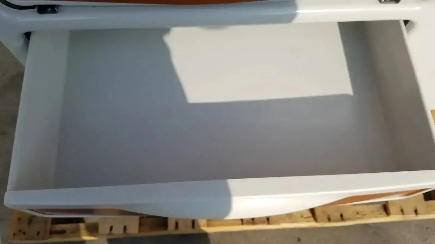 White plastic drawer with glossy finish and rounded edges on ritter by midmark exam table model 204-011 for buy used medical equipment