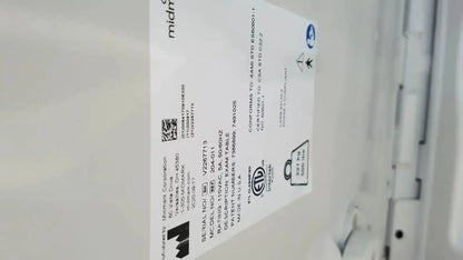 White rectangular label with black text on the back of ritter by midmark exam table model 204-011 used medical equipment for sale