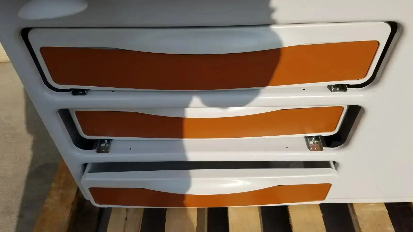 White and orange panelled storage drawers with sleek modern design on ritter by midmark exam table model 204-011 for buy used medical equipment