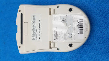 White plastic roche coaguchek s medical equipment showing barcode and technical service label on the back side for reuse medical equipment