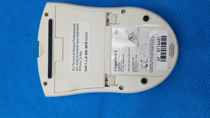 White plastic Roche CoaguChek S coagulation meter medical equipment showing rectangular label and barcode on back side