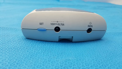 White plastic Roche CoaguChek S coagulation meter with blue set button and data ports for reuse medical equipment