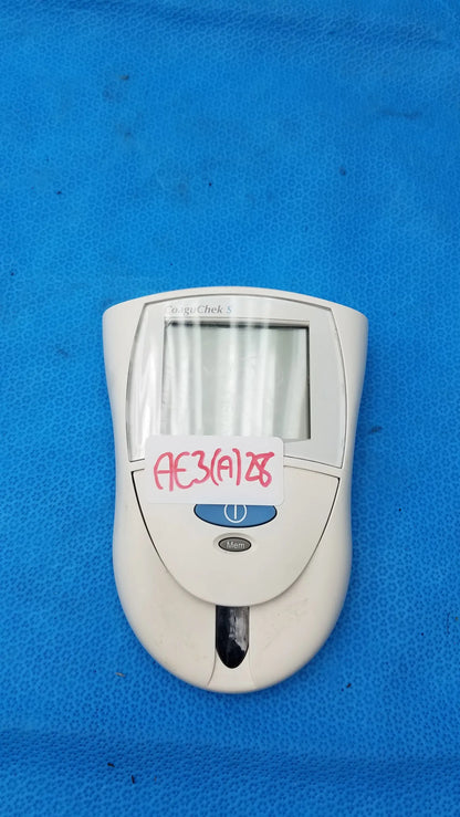 White plastic Roche CoaguChek S coagulation meter with blue power button and lcd screen for reuse medical equipment