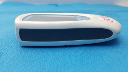 White and black handheld roche coaguchek xs plus coagulation meter with digital display medical equipment device