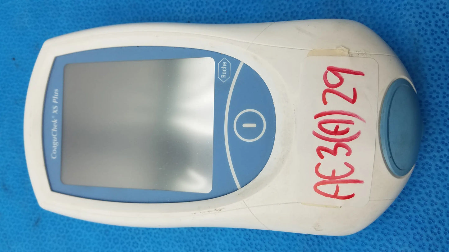 White and blue handheld roche coaguchek xs plus coagulation meter with digital screen medical equipment by fischertechnik