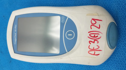 White and blue handheld roche coaguchek xs plus coagulation meter with digital screen medical equipment by fischertechnik
