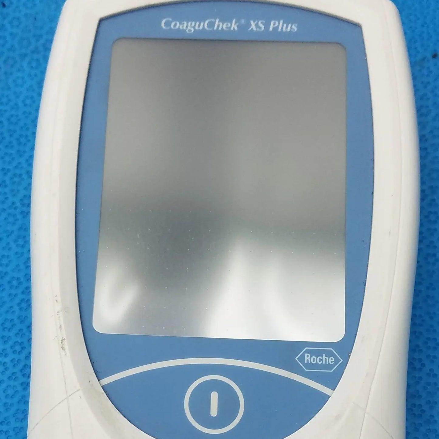 White and blue roche coaguchek xs plus coagulation meter medical equipment for blood clotting analysis