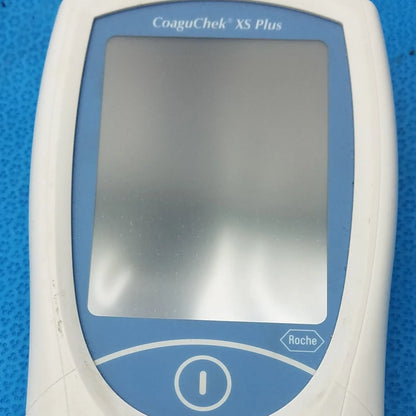 White and blue roche coaguchek xs plus coagulation meter medical equipment for blood clotting analysis
