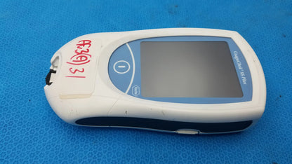 White and blue plastic Roche CoaguChek XS Plus coagulation meter with screen and buttons for medical equipment use