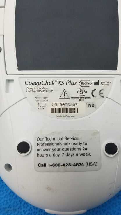 White roche coaguchek xs plus coagulation meter with matte finish showing labeled specifications on back panel of medical equipment