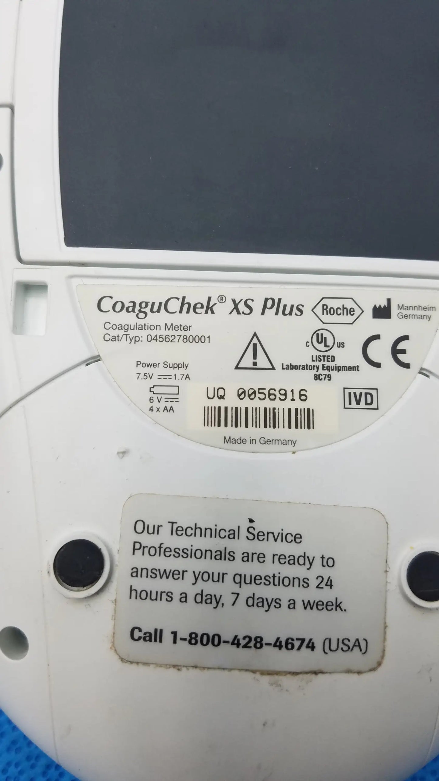 Roche CoaguChek XS Plus coagulation meter with white body and gray display panel for accurate medical testing