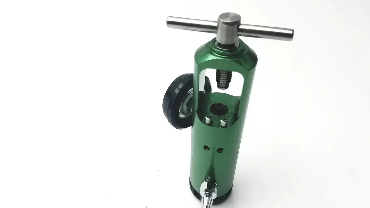 Green metallic roscoe medical mini oxygen regulator with silver t-handle and black wheel for precise control