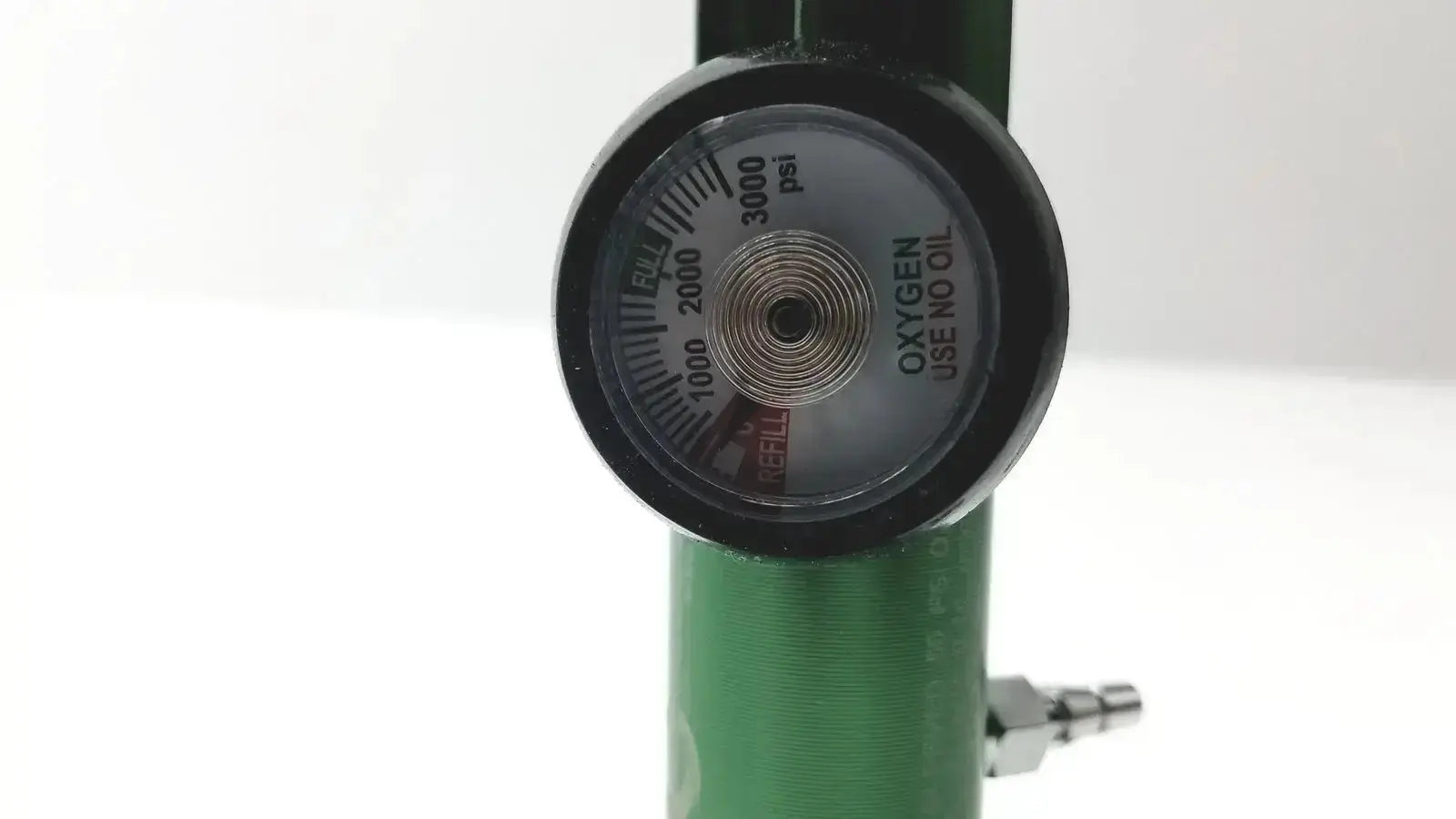 Green cylindrical roscoe medical mini oxygen regulator with black psi gauge and oxygen use no oil text, ref 1502803